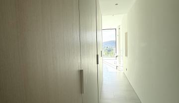 Resa Estates Can Furnet Ibiza te koop sale modern villa sea dalt villa views hallway bedroom.jpeg